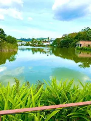 a view of a river with buildings in the distance at Peaceful Retreat Villa by Nai Thon beach in Phuket Town