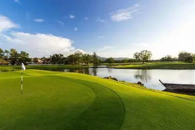 a view of a golf course with a lake at Kamala Beach D49 Exclusive Junior Suite in Kamala Beach