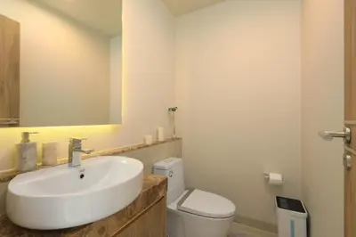 a bathroom with a sink and a toilet at Zenithy Pool Villas by Capitalpro ZEN-9 in Phuket Town