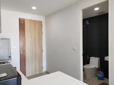 a small bathroom with a toilet and a sink at 7 Floor - Ozone Condotel near Kata beach by 15 minutes walking in Kata Beach