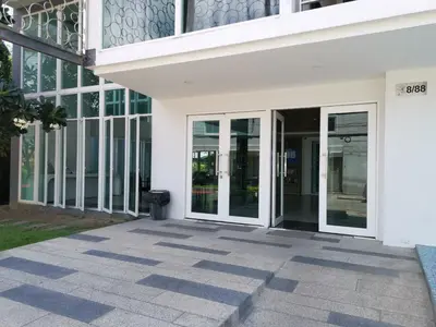 an entrance to a building with glass doors at 7 Floor - Ozone Condotel near Kata beach by 15 minutes walking in Kata Beach