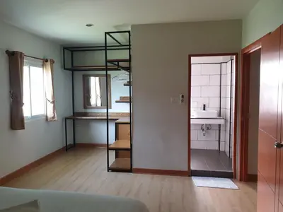 a room with a bathroom with a sink and a mirror at My Friend's House Villa in Karon Beach