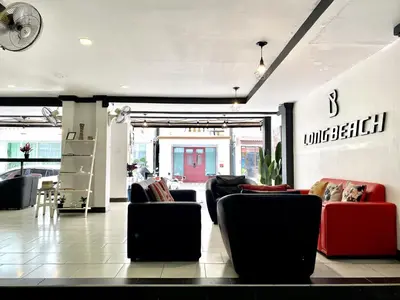 a lobby with couches and chairs in a store at Beachwalk Patong in Patong Beach