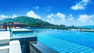 a swimming pool with a view of a mountain at The Aristo-1-213 in Phuket Town