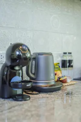 a coffee maker sitting on top of a counter at Modern Rustic 4 Bedrooms Villa, Walk to Rawai & Yanui Beach in Nai Harn Beach