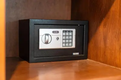 a microwave oven sitting on top of a wooden wall at Oceanview Bungalows by EAT in Karon Beach