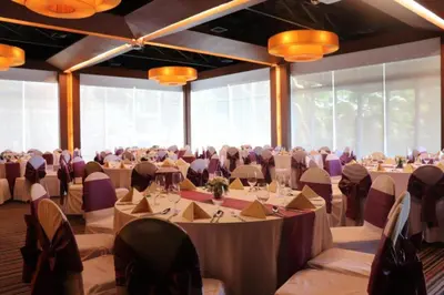 a large banquet hall with tables and chairs at Club Wyndham Sea Pearl Phuket in Patong Beach