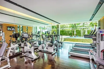 a gym with a bunch of cardio equipment in it at Club Wyndham Sea Pearl Phuket in Patong Beach