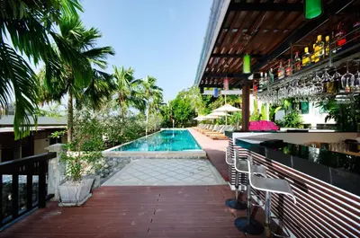 a resort with a swimming pool and a bar at Club Wyndham Sea Pearl Phuket in Patong Beach