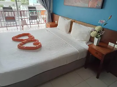 a bed with a heart decoration on it at Sleep Easy in Kata Beach