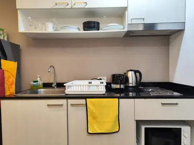 a kitchen with a sink and a counter top at Rawai beachfront - One bedroom on 3 floor at Title in Rawai Beach