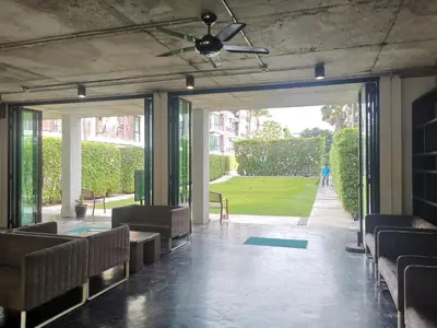 an empty room with chairs and a ceiling fan at Rawai beachfront - One bedroom on 3 floor at Title in Rawai Beach