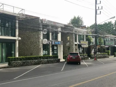a car parked in a parking lot in front of a building at Rawai beachfront - One bedroom on 3 floor at Title in Rawai Beach