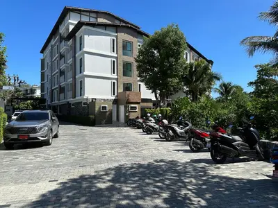 a row of motorcycles parked in front of a building at Title V Pool View 3fl Gym Hammam Rawai in Rawai Beach