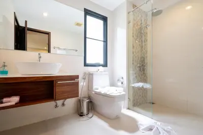 a bathroom with a sink and a toilet and a shower at New Apartment TTL B209 in New Rawai Beach Residence with Tropical Pools in Rawai Beach