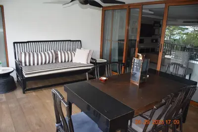 a living room with a table and a couch at KALIM RESIDENCE unit 132 VUE MER in Patong Beach