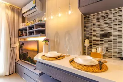 a kitchen with a counter with two plates on it at Kamala Beach D76 Exclusive Junior Suite in Kamala Beach