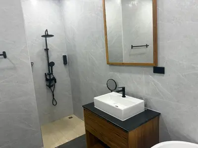 a bathroom with a sink and a mirror at Beautiful private 4 bedroom villa with pool and gym in Rawai Beach
