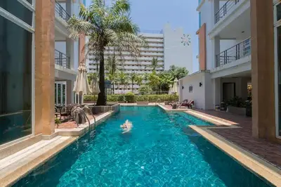 a swimming pool in the middle of a building at Haven Lagoon Condominium in Patong Beach