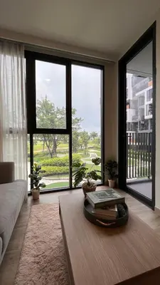 a living room with a table with books on it at Sky Park Laguna 1 bedroom Golf View in Bang Tao Beach