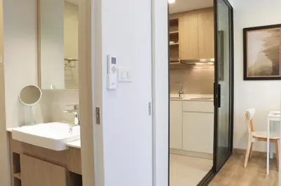 a bathroom with a sink and a mirror at Sky Park Laguna 1 bedroom Golf View in Bang Tao Beach
