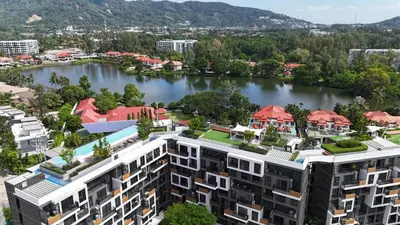 an aerial view of a building next to a river at Sky Park Laguna 1 bedroom Golf View in Bang Tao Beach