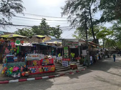 an outdoor market with a lot of items on display at Nai Harn beach - Studio room on 2 floor at ReLife The Windy in Rawai Beach
