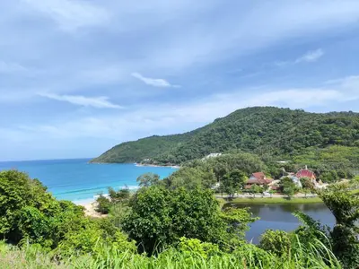 a view of the shoreline of a beach and the ocean at Nai Harn beach - Studio room on 2 floor at ReLife The Windy in Rawai Beach