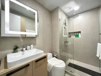 a bathroom with a sink and a shower at Silk Ao Nang Condominium in Ao Nang Beach
