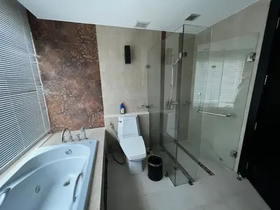 a bathroom with a tub and a toilet and a shower at Luxurious 3BR Penthouse Jacuzzi Seaview in Kamala Beach