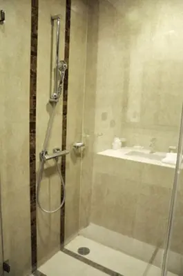 a shower with a glass door in a bathroom at Luxurious 3BR Penthouse Jacuzzi Seaview in Kamala Beach