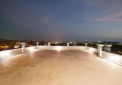 a view from the roof of a building at night at Nature Pine Phuket เนเชอร์ไพน์ภูเก็ต in Rawai Beach