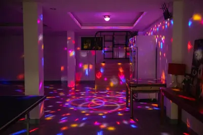 a room with purple and pink lights on the floor at Phuket Superior Sunrise Sea View Private Pool Villa in Kata Beach