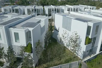 an artist rendering of a building with solar panels on its roofs at Exquisite Pool Residence A19: Aesthetics and Luxury Combined in Bang Tao Beach