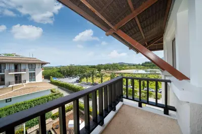 a balcony with a view of a building at 4BR Penthouse Royal Marina 6B Private Rooftop Pool with 360 View in Phuket Town