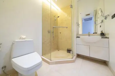 a bathroom with a shower and a toilet and a sink at 4BR Penthouse Royal Marina 6B Private Rooftop Pool with 360 View in Phuket Town