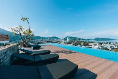 a swimming pool on the roof of a building at The Unity and The Bliss Patong Residence in Patong Beach