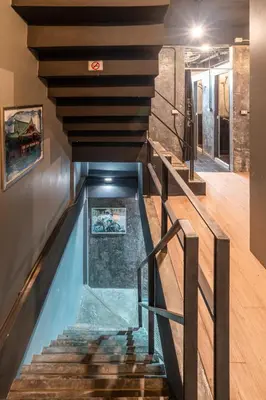 a swimming pool in the middle of a house at Black Panther Hostel in Phuket Town