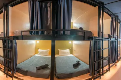 a couple of bunk beds in a room at Black Panther Hostel in Phuket Town