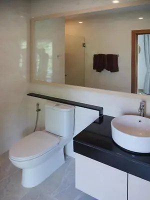 a bathroom with a toilet and a sink at Karon beach apartment & sea view pool in Karon Beach