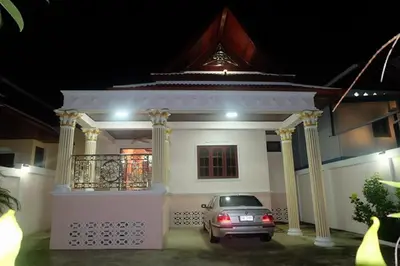 a car parked in front of a house at night at Majestic Villas Phuket in Rawai Beach
