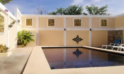 a swimming pool in the backyard of a house at Majestic Villas Phuket in Rawai Beach
