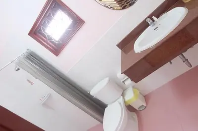 a bathroom with a toilet and a sink at Majestic Villas Phuket in Rawai Beach