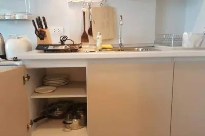 a kitchen with a sink and a counter top at At Laguna at Zcape Condo in Bang Tao Beach