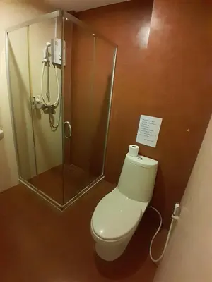 a bathroom with a toilet and a shower at Toto Residence in Ao Nang Beach