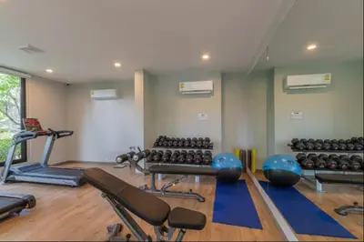 a gym with several exercise equipment in a room at 2 Bedroom Apartment in Naiyang - The Title Residences, Naiyang in Nai Yang Beach