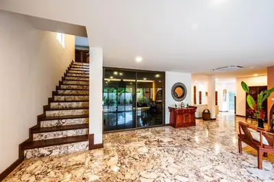 a lobby with a staircase and marble floors at Kinnaree Grand Villa - pool, panoramic views, maid in Kamala Beach