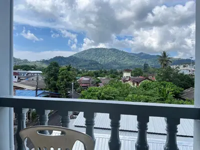 a balcony with a view of a mountain at AB House in Kathu
