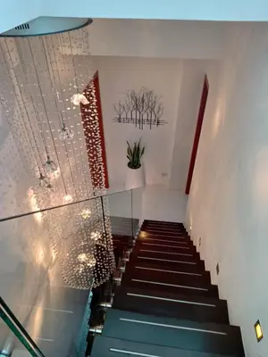 a staircase in a building with blue stairs at Lucky Villa Kamala in Kamala Beach