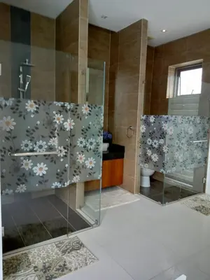 a bathroom with a shower and a glass shower stall at Lucky Villa Kamala in Kamala Beach
